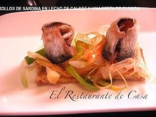 Rollos de sardina en lecho de calsot y vinagreta de olivada